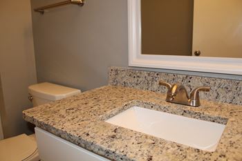 Bathroom with granite countertops and undermount sinks